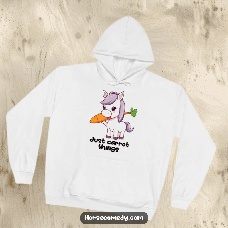 Funny horse character joyfully munching a giant, colorful carrot, featured on a warm hoodie, ideal for a funny gift.