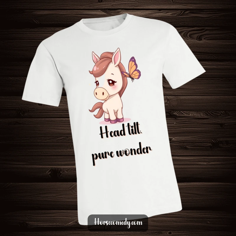 Funny T-Shirt showing a horse with a curious head tilt, attentively watching a butterfly, expressing gentle fascination.