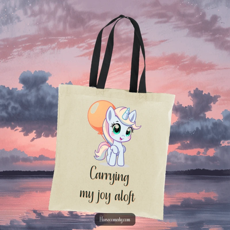 Funny pony tote bag with wide, curious eyes, balancing a large, colorful balloon.